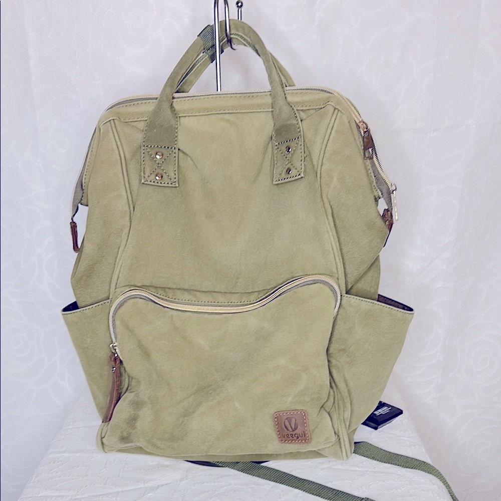 VEEGUL khaki green multipurpose canvas backpack with single pockets.